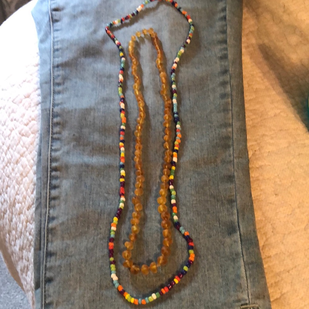 Pair of bead necklaces one multi one amber like